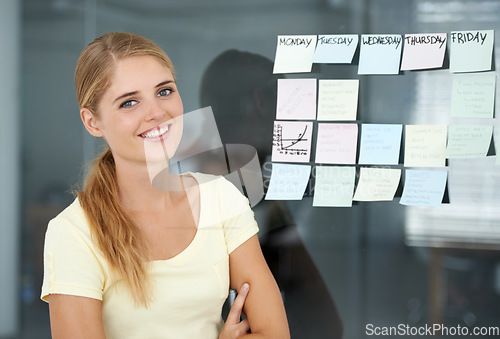Image of Woman, planning and sticky notes on glass, graph and smile for seminar, creative and portrait. Presentation, strategy and office job for weekly schedule, workplace and financial audit report