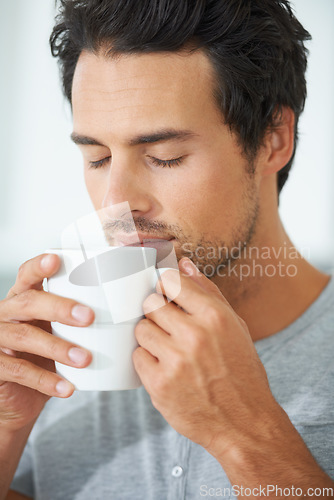 Image of Man, coffee and cup smell for relax drink or morning breakfast beverage, calm daydream on lazy weekend. Male person, mug and caffeine latte for peace cappuccino aroma in home, quiet time for comfort