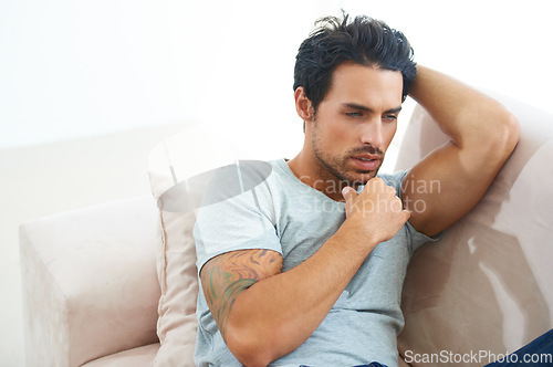 Image of Man, thinking on sofa in home as decision idea or problem solving, future wondering or day plans. Male person, couch and daydream as relax rest or brainstorming doubt as planning, questions or choice