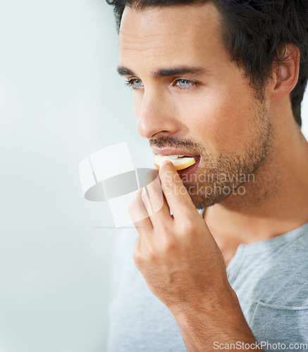 Image of Man, face or eating apple fruit for morning diet, healthy lifestyle choice or clean nutritionist breakfast, organic snack or vitamin. Natural detox, nutrition food or person bite antioxidants product