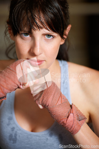 Image of Boxing, hands and portrait of woman with confidence, power and fearless training challenge in gym. Strong body, muscle and face of boxer, athlete or girl with fist up for fitness in competition fight