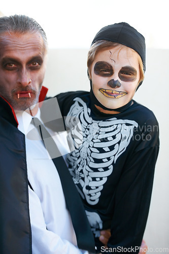 Image of Portrait, halloween and costume with a father and his son outdoor for a trick or treat tradition together. Family, horror or spook with a parent and child in an outfit for celebration in the holidays