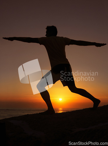 Image of Silhouette, man or stretching with hands for yoga, health and wellness on beach with sunset and zen. Person, shadow and pilates or arm workout for balance, mindfulness or healthy body by ocean or sea
