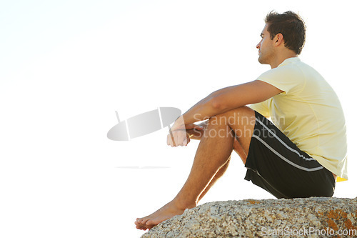 Image of Man, thinking or rock and cliff in nature for travel, adventure or scenery with sunshine, vision and view. Person, mountain or sky for holiday, vacation or experience outdoor and freedom or barefoot