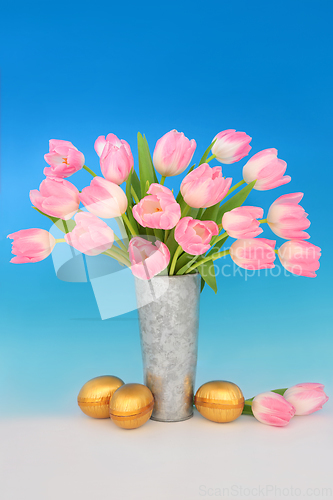 Image of Gold Easter Eggs and Spring Tulip Flower Bouquet