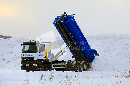 Image of Mercedes-Benz Tipper Truck Unloads Snow