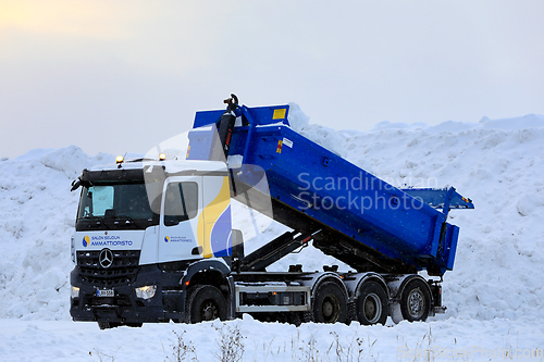 Image of Mercedes-Benz Tipper Truck Unloading Snow