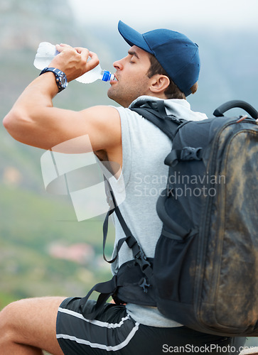 Image of Man, hiking and drinking water in nature rest for fitness, exercise and workout in Brazil mountains. Hiker, athlete and person with liquid bottle for summer sports break, electrolytes and wellness