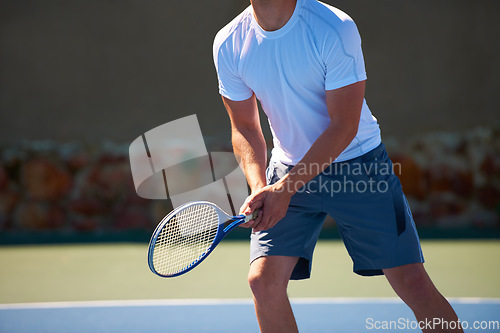 Image of Man, racket and ready for tennis match, athlete and sports on court, turf and fitness. Male person, cardio and exercise or practice in outdoors, training and active for competition, skill and game