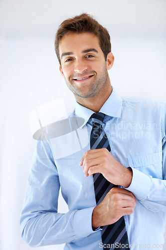 Image of Businessman, portrait and happy or dressing with shirt, professional or employee at corporate job. Entrepreneur, face and person for smile, confidence and pride with calm expression or hands at work