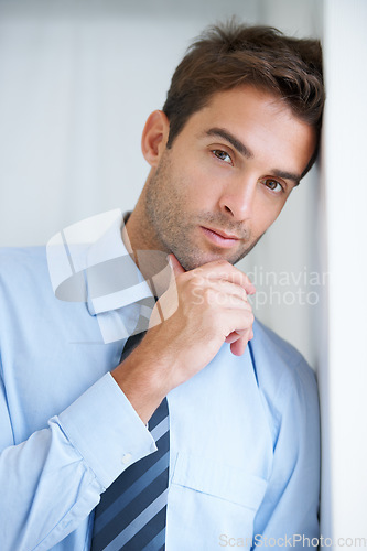Image of Thinking, wall and portrait of business man in office with confidence, pride and ambition. Corporate, professional and face of entrepreneur with ideas for company, career and job in workplace
