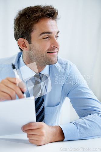 Image of Business man, thinking and writing on documents for financial report, audit review and asset management in office. Auditor, accountant or manager with decision and signature on paperwork or contract