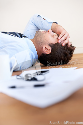 Image of Business man, stress and headache or burnout, floor and exhausted or mental health, paperwork and overwhelmed. Male person, migraine and tired or frustrated, rest and fatigue for mistake and fail