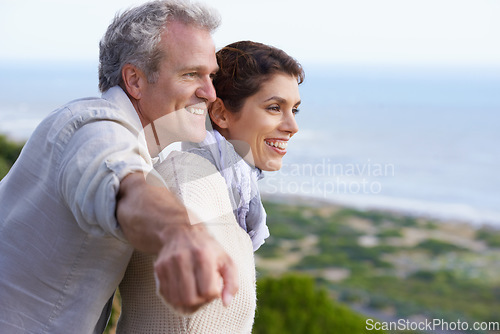 Image of Mature couple, happy and outdoor on vacation, airplane hands and weekend for enjoying holiday. Man, woman and bonding together with smile, marriage and commitment with affection, seaside and joyful