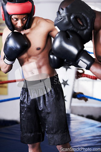 Image of Boxing, man and sparring partner in ring together with headgear, gloves and fitness, power training, challenge. Strong body, fighting hit and boxer in helmet, fearless and confident in competition.