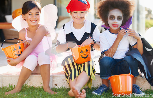 Image of Children, halloween and candy bucket for costume fun or dracula dress up, fairy or pirate role play. Friends, group and pumpkin basket as dessert or trick or treat celebration, fantasy or development