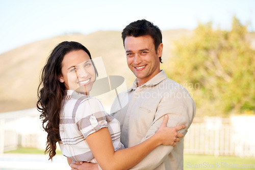 Image of Couple, happy and portrait with hug and garden with joy, smiling and young people. Marriage, outdoor and love for commitment, bonding together and care for romantic relationship, man and woman