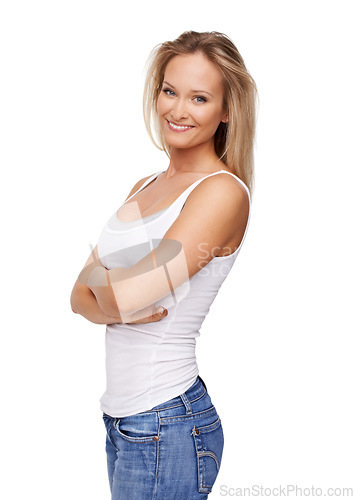 Image of Confident, fashion and portrait of woman on a white background with crossed arms, pride and attractive. Happy, smile and isolated person in casual clothes, trendy outfit and style in jeans in studio