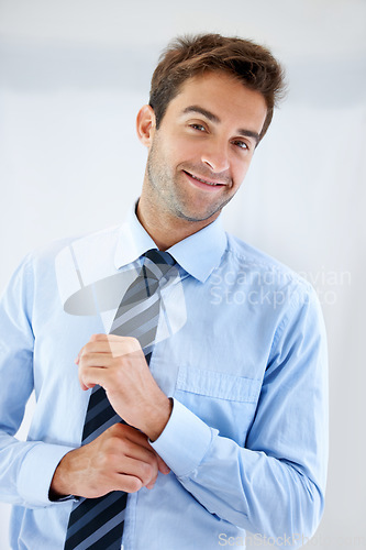 Image of Businessman, portrait and happy in office for career, professional and employee at corporate job. Entrepreneur, face and person for smile, confidence and pride with calm expression or hands at work