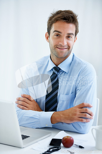 Image of Businessman, confidence and smile in portrait, laptop and internet for connection, networking and email. Male person, strategy and pride in career, happy and technology for online research or face