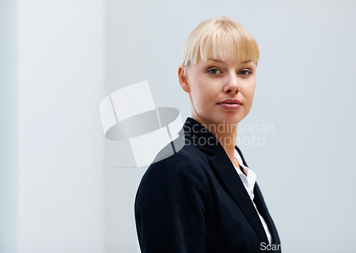 Image of Portrait, confidence and business woman in office, workplace or corporate company on mockup space in Switzerland. Serious face, professional female agent and entrepreneur, worker and employee in suit