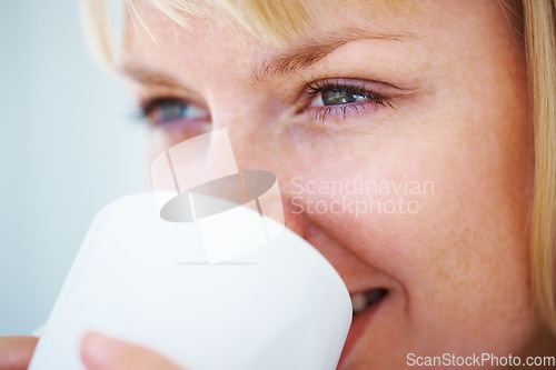 Image of Smile, coffee and young woman at her home relaxing on a weekend morning for calm mindset. Happy, mug and female person from Australia drinking cappuccino, latte or tea with positive attitude at house