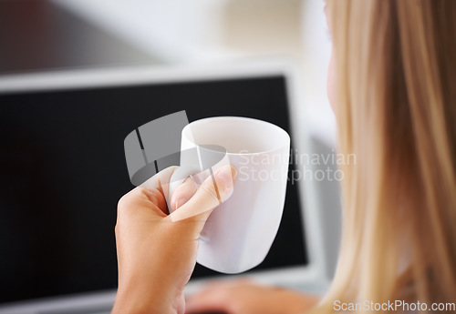 Image of Rear view, woman and coffee with laptop and screen for research, planning and business project in office. Entrepreneur, person and cup for tea, espresso or cappuccino with technology at workplace