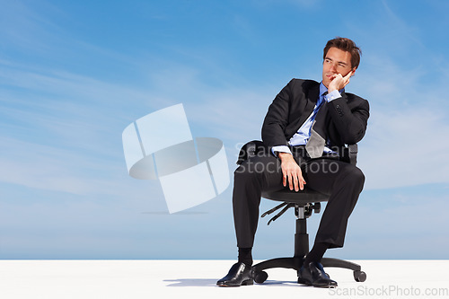 Image of Sky, space and a business man thinking on a chair for planning with vision for the future of his company. Corporate, idea and mockup with a young employee in a suit on a cloudy blue background