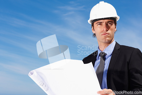 Image of Industry, blueprint and construction worker thinking by blue sky on building rooftop for planning. Engineering, professional and male industrial employee with architecture drawing for project.