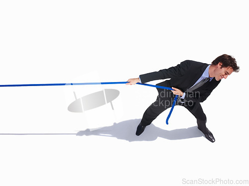 Image of Businessman, frustrated and tug of war by white background, career challenge and industry competition. Young person, mental health and professional worker with rope, top view and job battle in studio