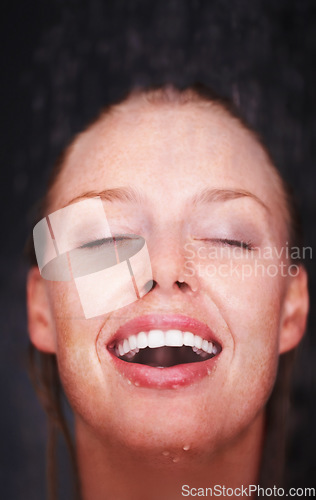 Image of Shower, water splash and face of happy woman in a house for hygiene, fresh or stress relief closeup. Smile, bathroom and female person relax with cleaning, wellness or body care, skincare or routine