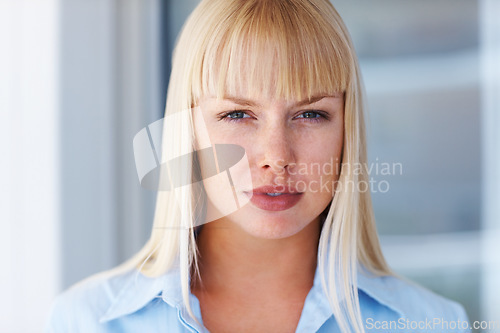 Image of Portrait, confidence and business woman in office, workplace and company career in Switzerland. Serious face, professional female agent or entrepreneur, worker or profile picture blonde employee