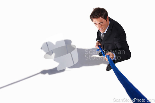 Image of Businessman, conflict and tug of war by white background, career challenge and workplace competition. Young person, mental health and professional worker with rope, top view and job stress in studio