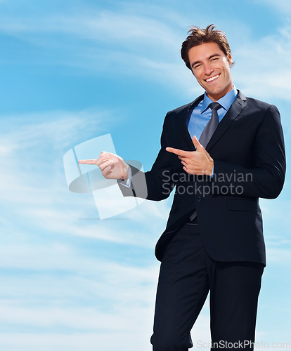 Image of Portrait, blue sky and business man point at corporate announcement, company notification or legal consultant info. Happiness, freedom and professional lawyer, attorney or advocate advertising news