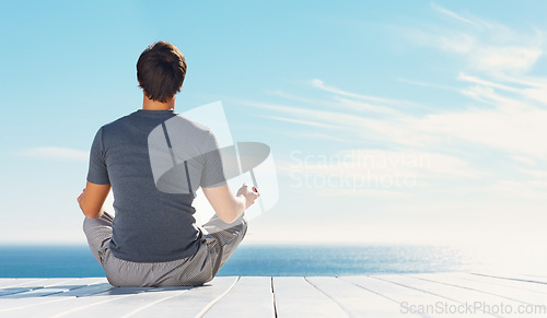 Image of Relax person, blue sky and yoga meditation for spiritual peace, freedom or healing zen soul, aura or chakra energy balance. Mockup space, sunshine and back of mindfulness yogi on nature beach patio