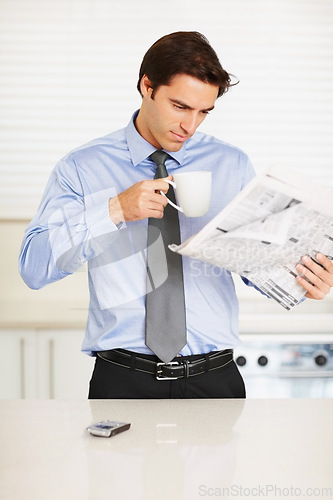 Image of Business man, reading newspaper and coffee cup in kitchen for thinking, idea or check stats on global market. Trader, investor and morning paper for announcement, stock and decision for financial job