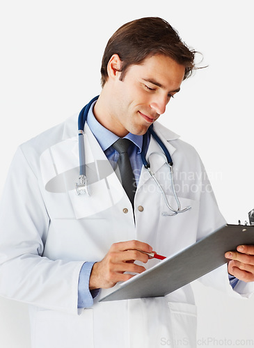 Image of Man, doctor and writing on clipboard for prescription, appointment or checklist against a white studio background. Male person, surgeon or medical professional smile with notes or life insurance