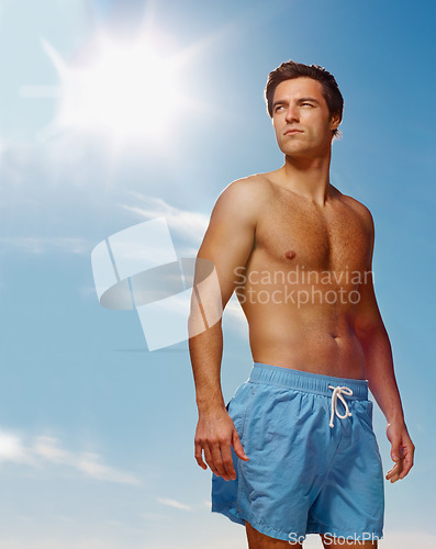 Image of Man, thinking or fitness in health body for summer workout, muscle or confident on vacation. Model, pride and natural glow with fashion gym shorts, post cardio exercise and sunshine by sky background