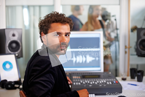 Image of DJ, musician and recording studio portrait with a man and music producer with tech and computer. Sound engineer, audio technician and media editor with professional in booth with synthesizer control