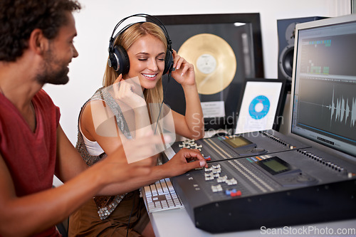 Image of Sound engineer, DJ listening and recording studio working on music, radio and audio with tech and staff. Producer, media and professional employee with synthesizer and happy from podcast industry