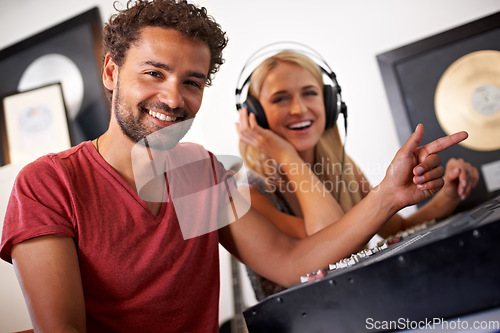 Image of Recording studio, musician and portrait of producer for music, radio songs and audio with musical instruments. Technology, soundboard and man and woman sound engineer or technician to record media