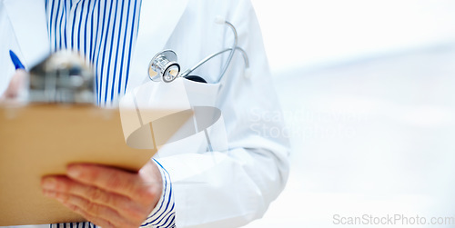 Image of Clipboard, hands and man doctor at hospital for planning, schedule or surgery checklist closeup. Healthcare, compliance and male surgeon zoom with admin for insurance, documents or results analysis