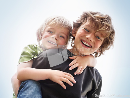 Image of Siblings, boy and brother or portrait with piggyback for bonding, relationship and freedom with blue sky. Family, male person or kids with play, care and love for happy, peace or support in nature