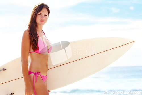 Image of Surfer woman, bikini and beach in portrait for fitness, walk or outdoor on vacation for exercise. Girl, athlete or person for water sports, pride or sunshine for workout, waves or freedom in Naples