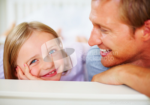 Image of Happy, portrait and father with kid on bed for bonding, relaxing and spending time together. Smile, love and young dad chilling and resting with girl kid from Australia in bedroom at family home.