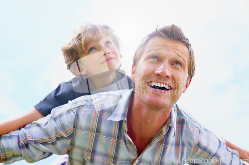 Image of Father, son and smile outdoor with piggyback for bonding, relationship and freedom with blue sky in nature. Family, man and boy child with playing, care and love for excitement, peace and support