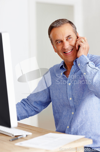 Image of Mature man at desk with computer, phone call and networking for happy business negotiation. Cellphone, discussion and senior businessman in office with smile, conversation and connection with deal.