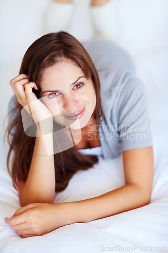 Image of Relax, happy and portrait of woman on bed for morning, dreaming and comfortable at home. Smile, beauty and face of person in bedroom resting, nap and wake up for health, wellness and calm on weekend