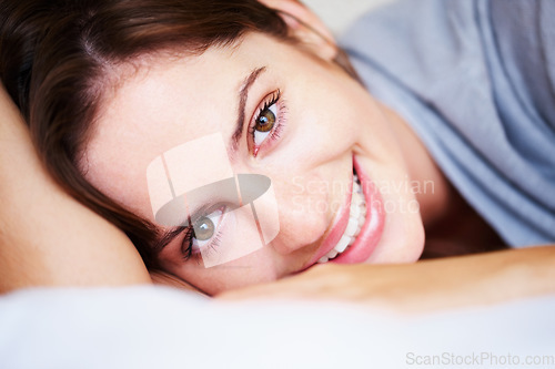 Image of Relax, smile and portrait of woman on bed for sleeping, dreaming and comfortable at home. Happy, cozy and face of person in bedroom resting, nap and wake up for health, wellness and calm in morning