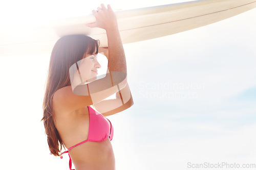 Image of Smile, surfboard and woman in bikini on beach for summer vacation, travel adventure and sunshine on tropical island. Surfing, blue sky and girl at ocean for happy holiday, sun and peace in Hawaii.